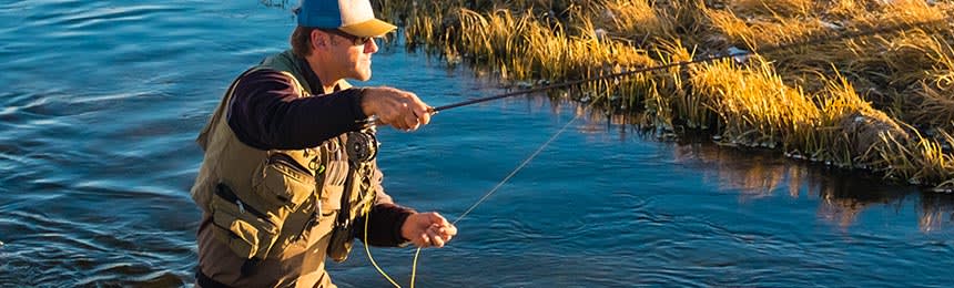 Man fly fishing with sunglasses