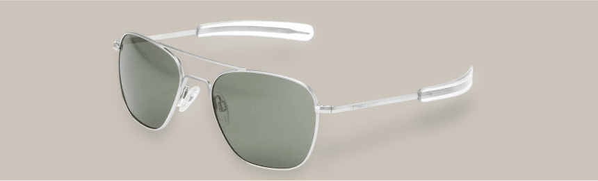 Still life of metallic Bayonetta glasses with distinctive bayonet-style temples on a neutral background.